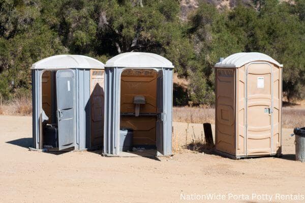 a clean row of portable restrooms for outdoor weddings or festivals in Olar, SC